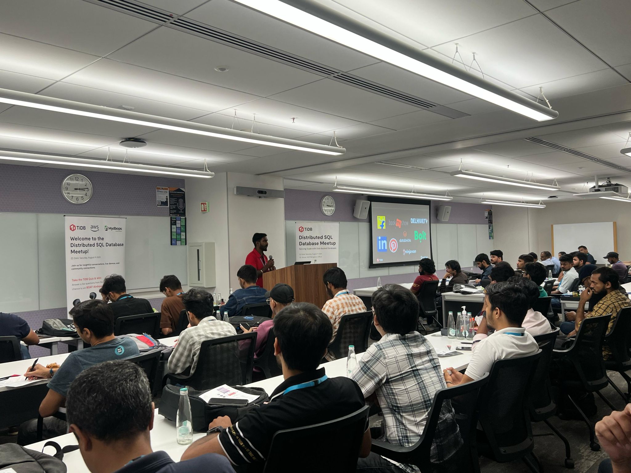 Kabilesh P R, Co-Founder of Mydbops, sharing practical insights on database migration and management with the audience.