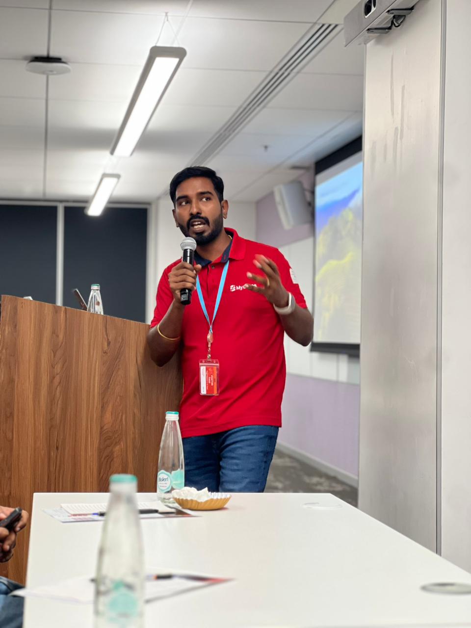 Kabilesh P R, Co-Founder of Mydbops, sharing practical insights on database migration and management with the audience.