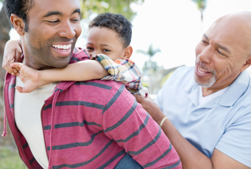 A father, son and grandson having a good time together.