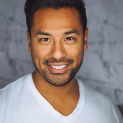  close up photo smiling man with white top