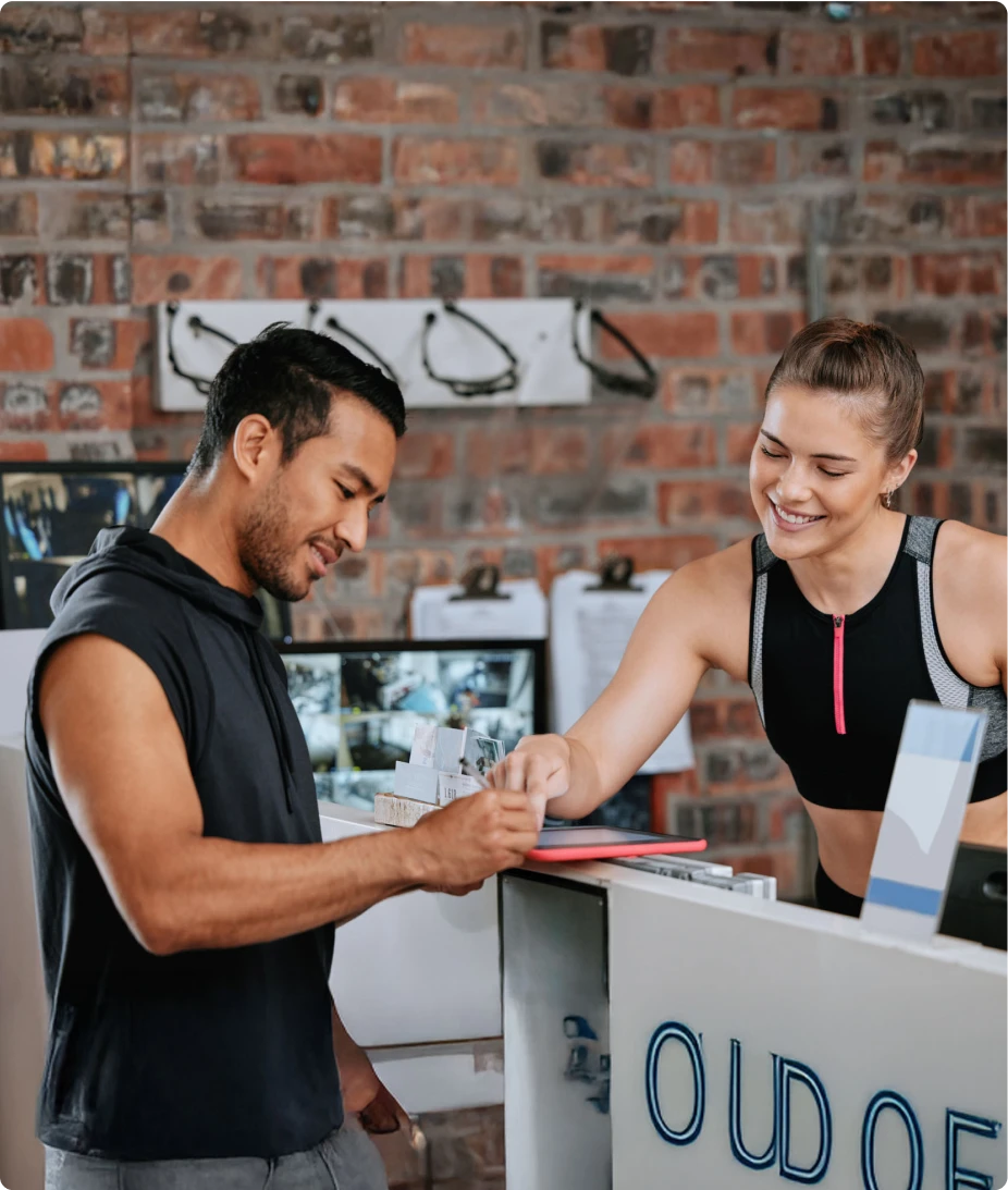 Customer interacting with retail associate at checkout counter using AI-powered service assistant