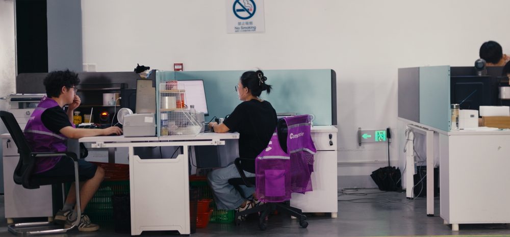 Commercive staff working at desks inside the fulfilment centre