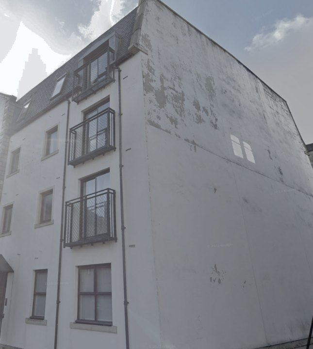 West Silvermills, Edinburgh: gable wall before repair, with render peeling and stained