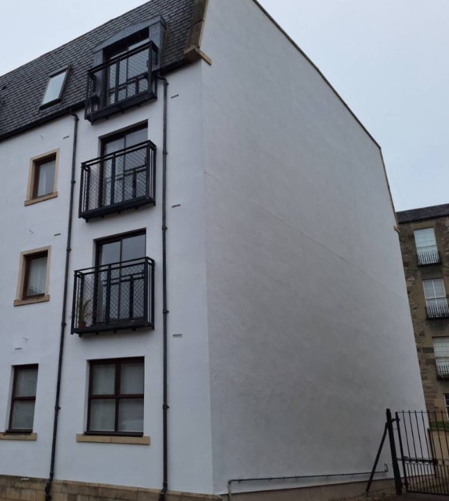 West Silvermills, Edinburgh: the same gable wall after re-rendering, clean and freshly painted
