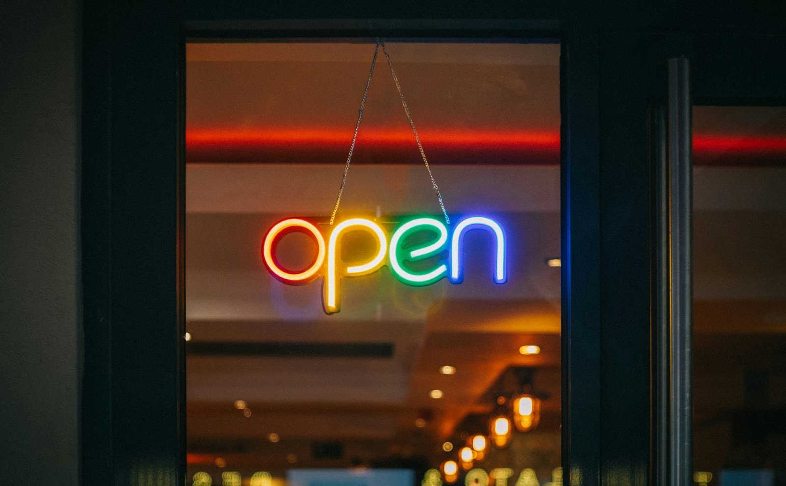 A neon open sign in a restaurant