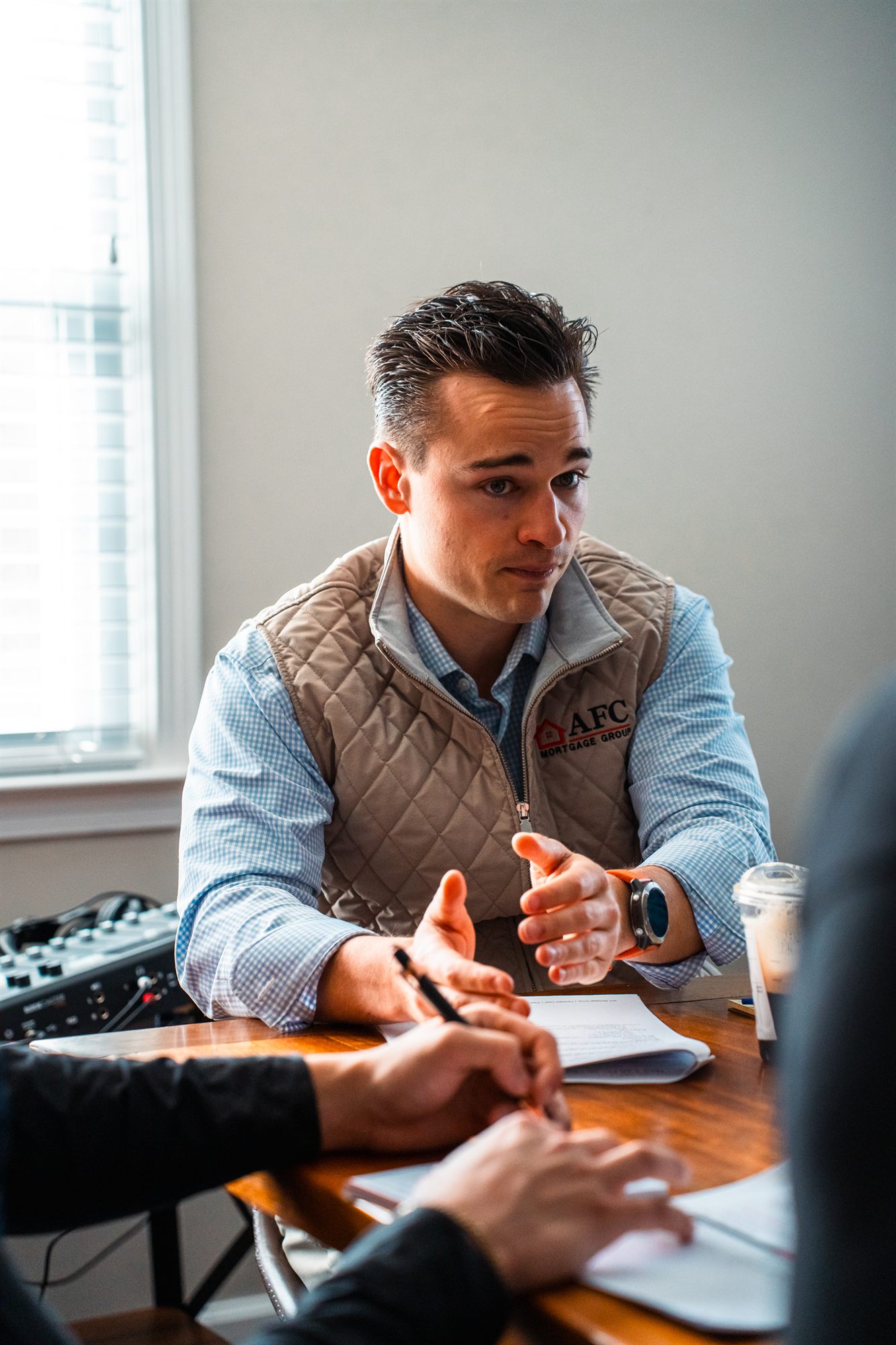 AFC Home Finance Advisor explaining across the table