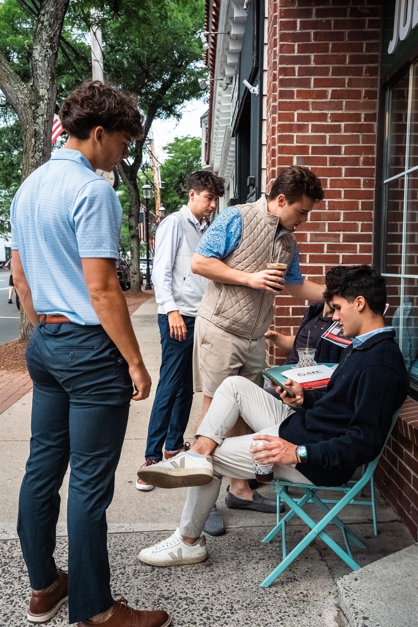 AFC crew huddled outside the coffee shop