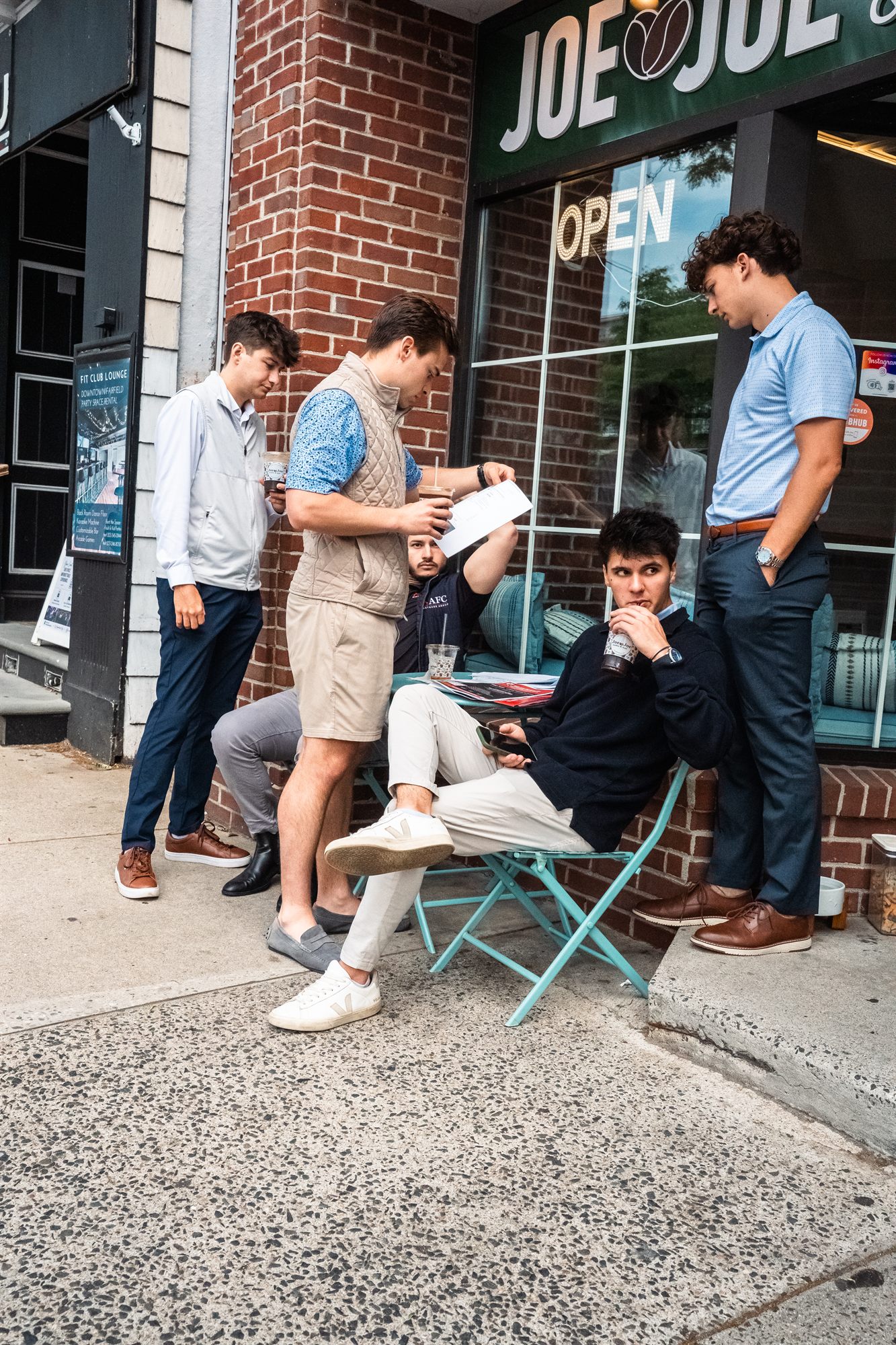 AFC team going over details together outdoors