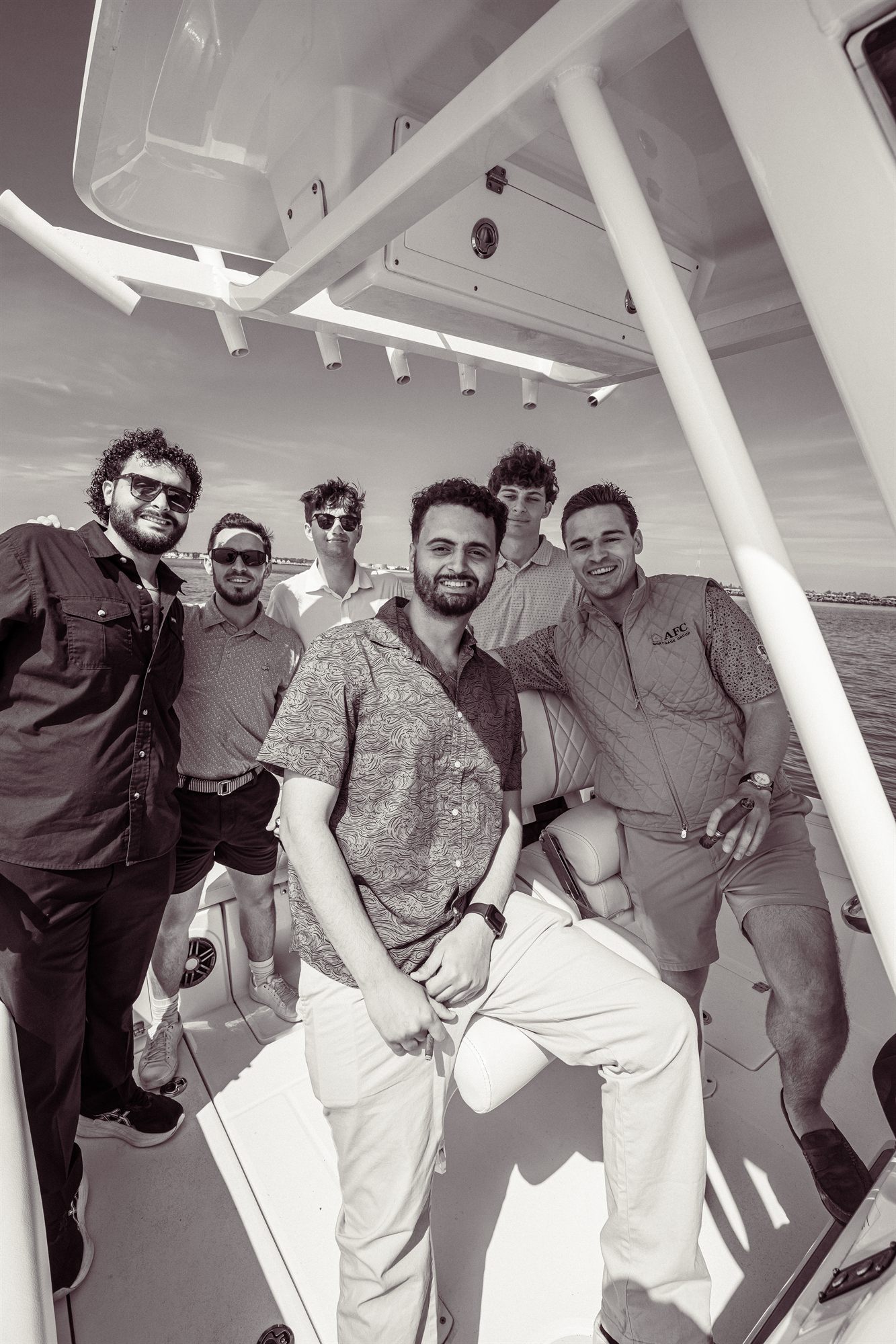 AFC team posed together on the boat bow