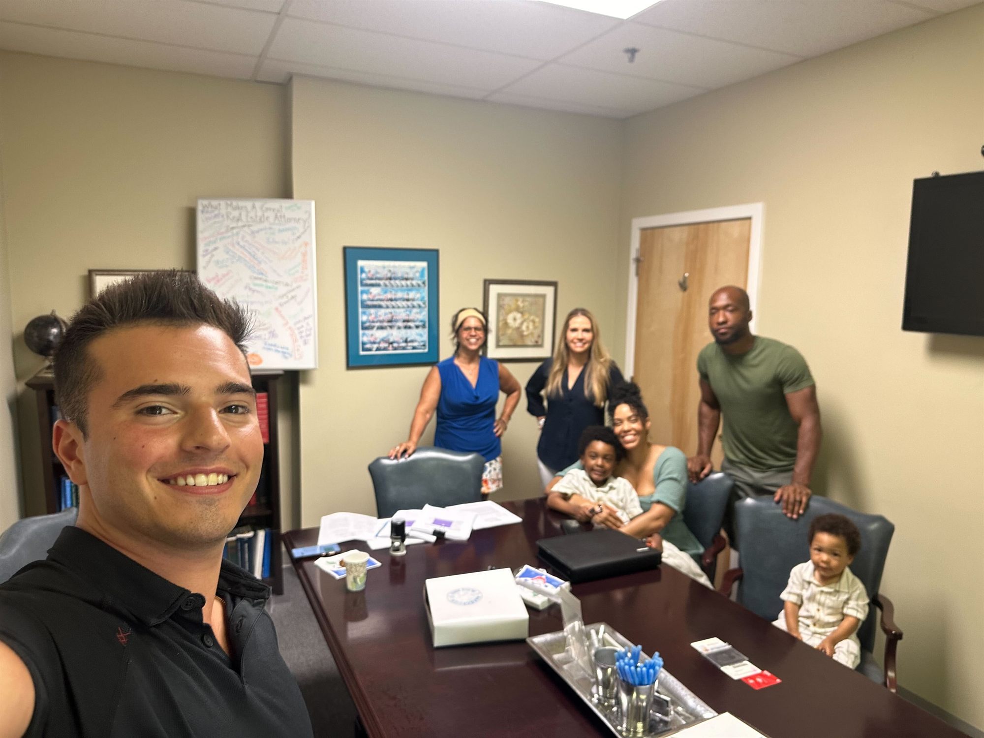Jacquelyn and family smiling together on closing day