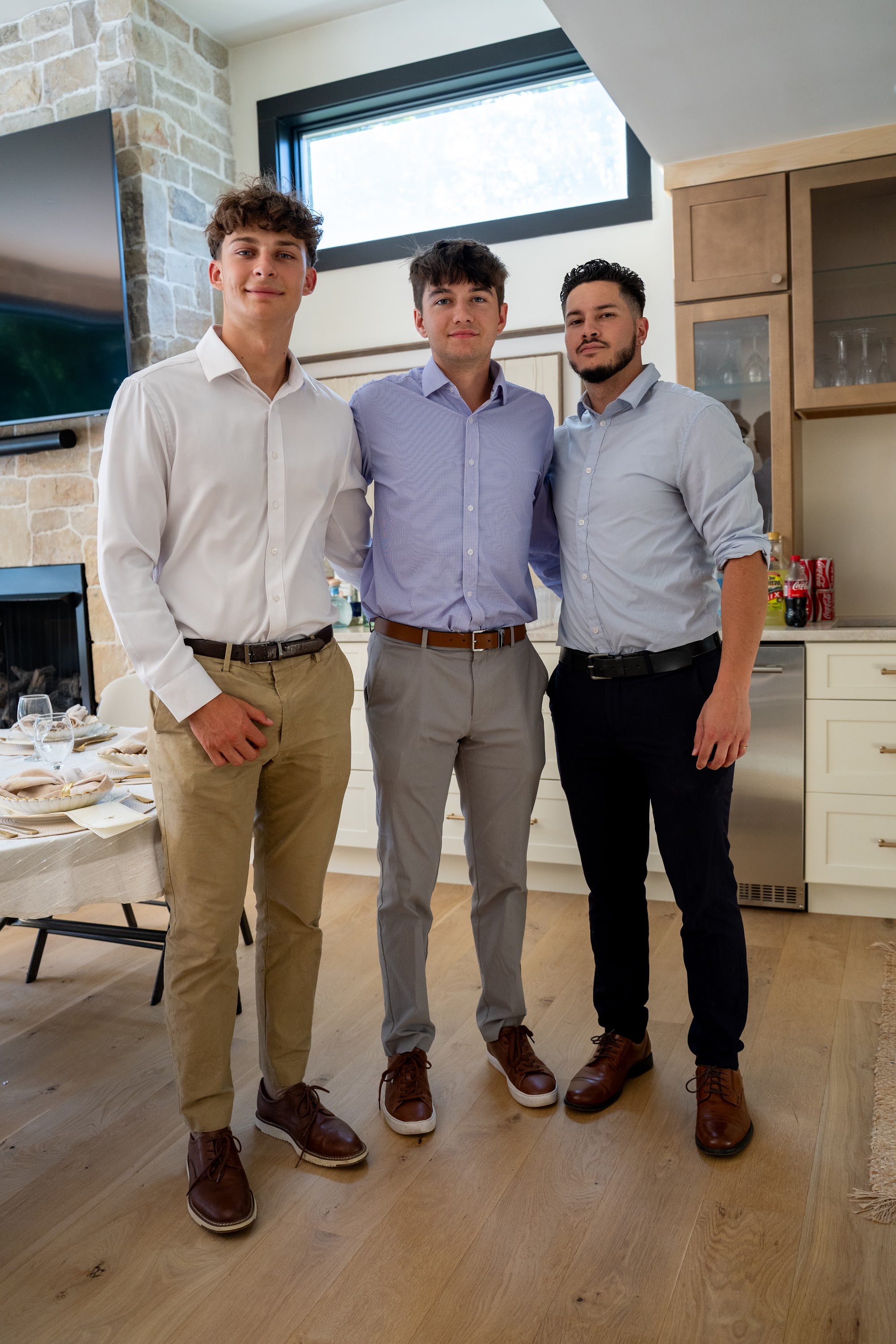 Three members of the AFC team together in the kitchen at the investor dinner