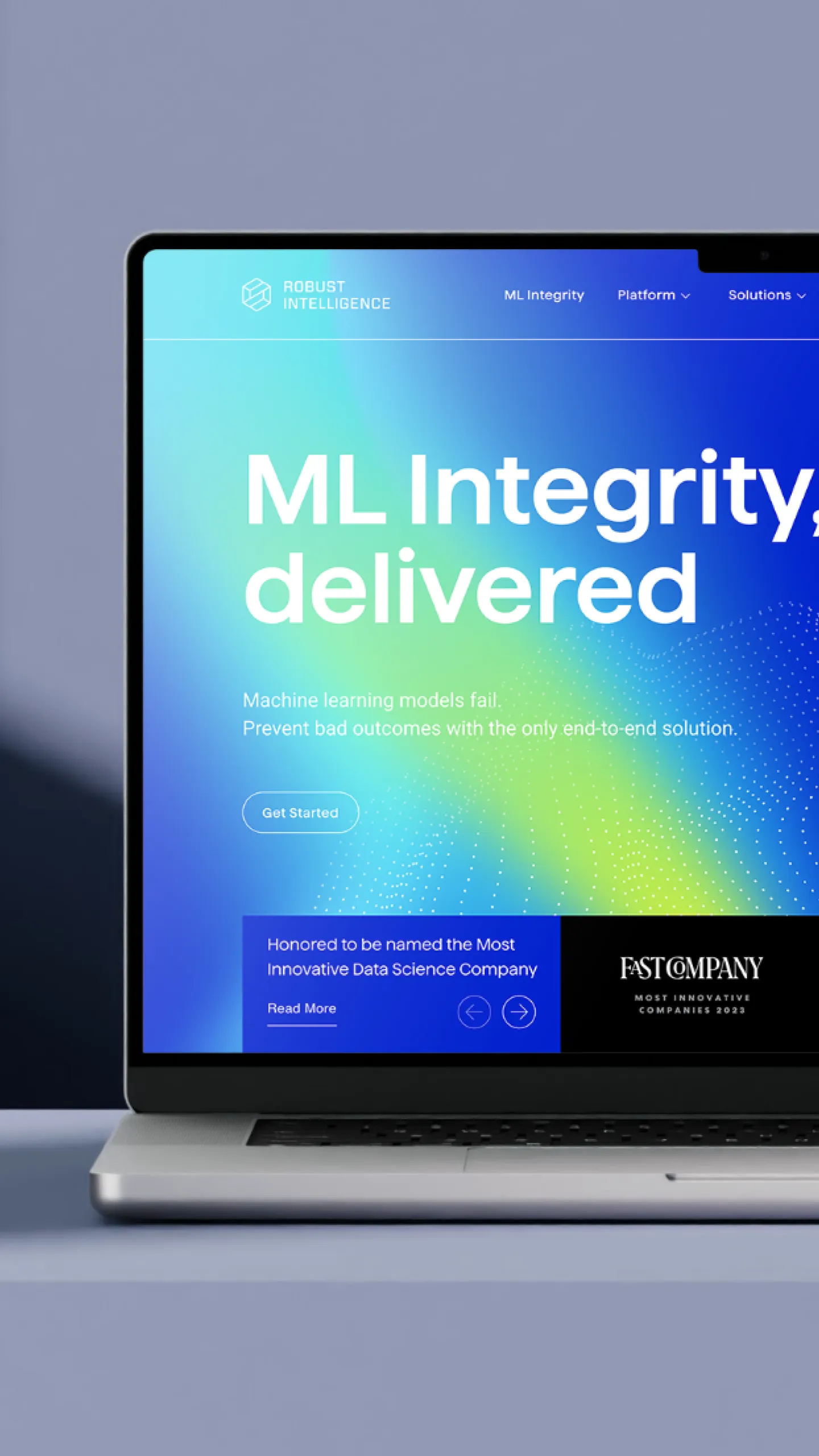 Robust Intelligence website on a laptop, with the headline "ML Integrity, delivered" over a blue gradient