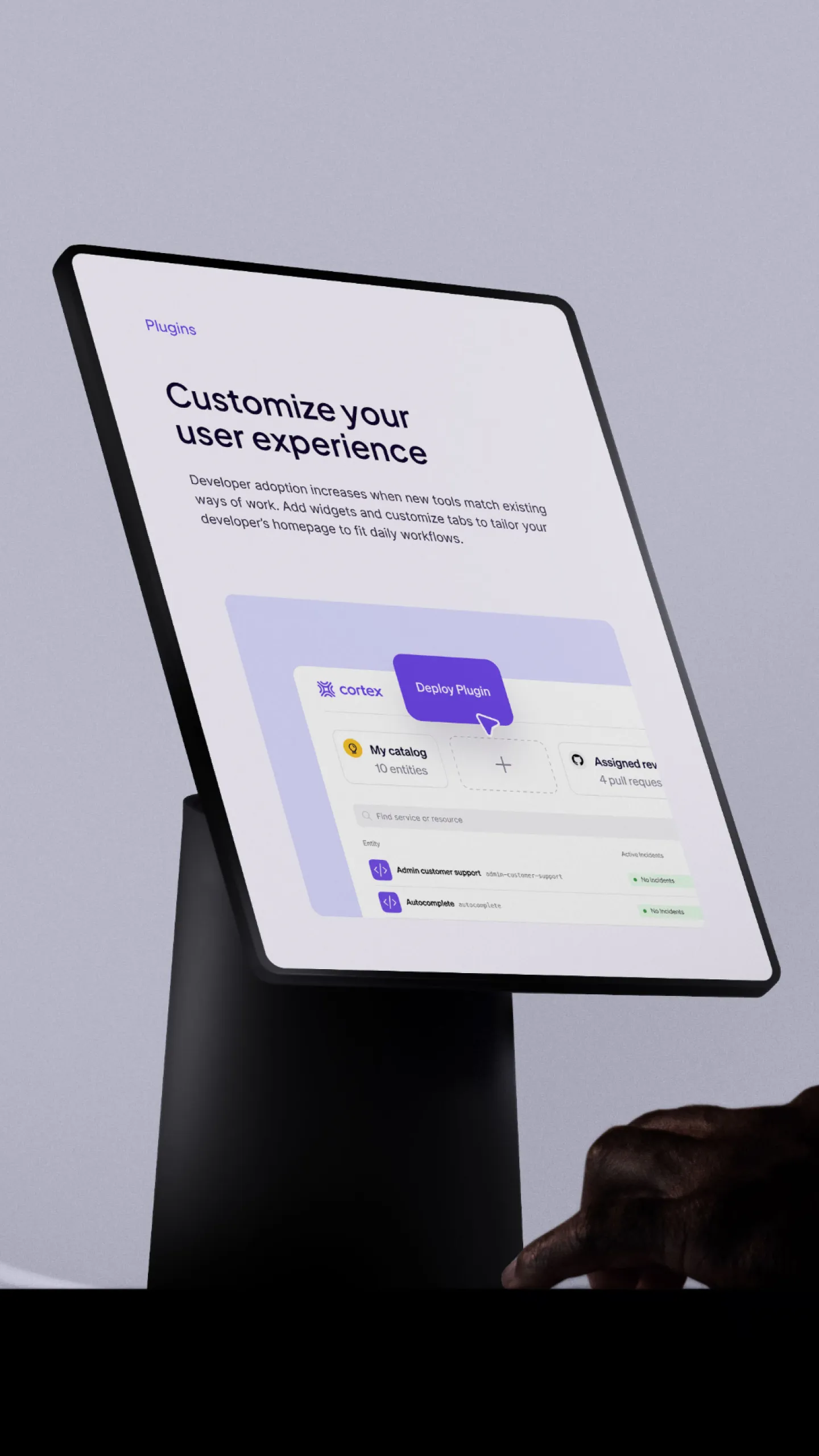Cortex website on a tablet mounted on a stand, showing the "Customize your user experience" plugins page
