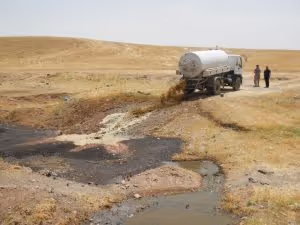 Faecal sludge being disposed of into a water body, Kurdish Region Iraq