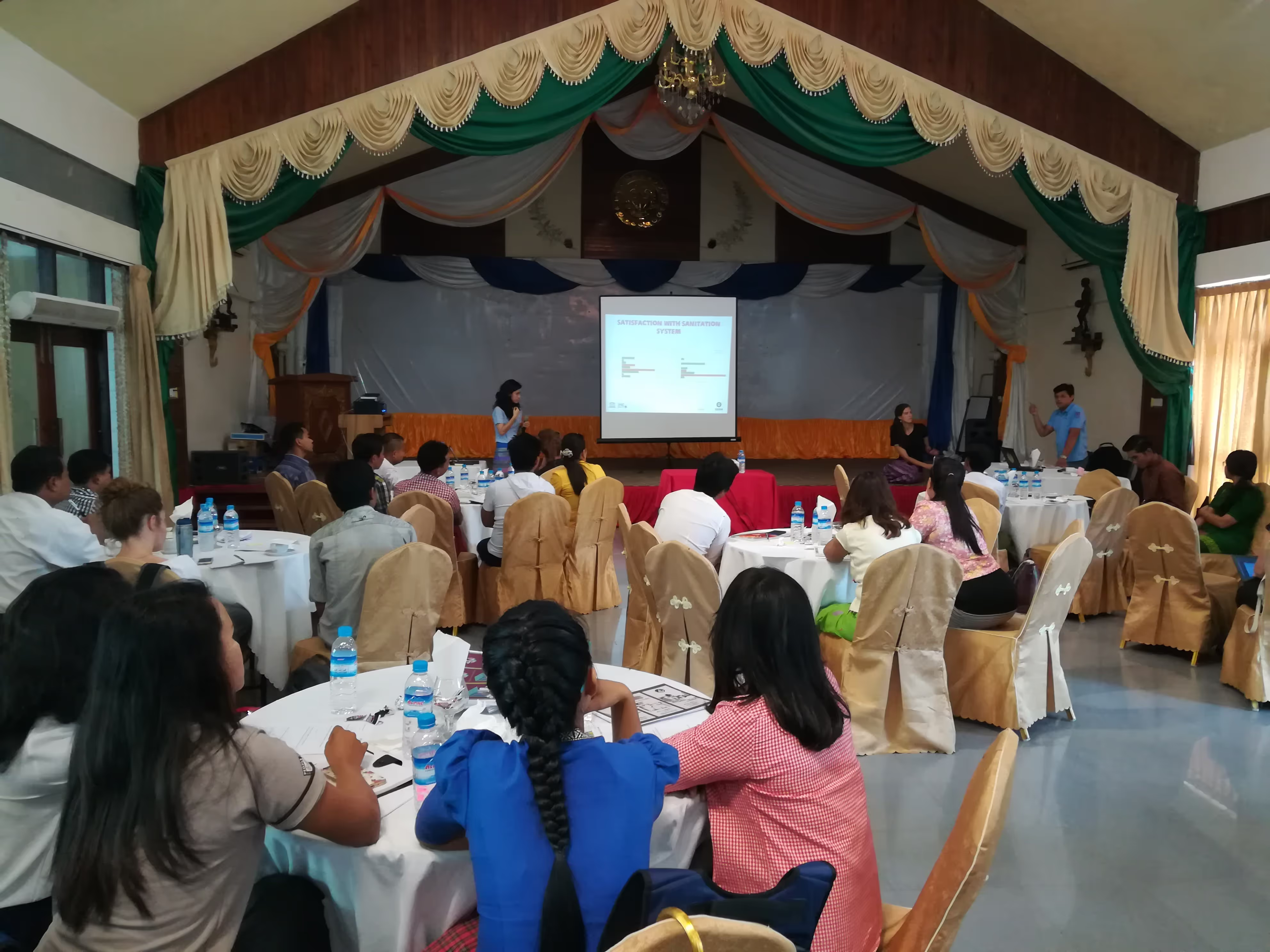 Workshop participants learning about Tiger Worm Toilet results (credit: Benedict Wood/Oxfam)