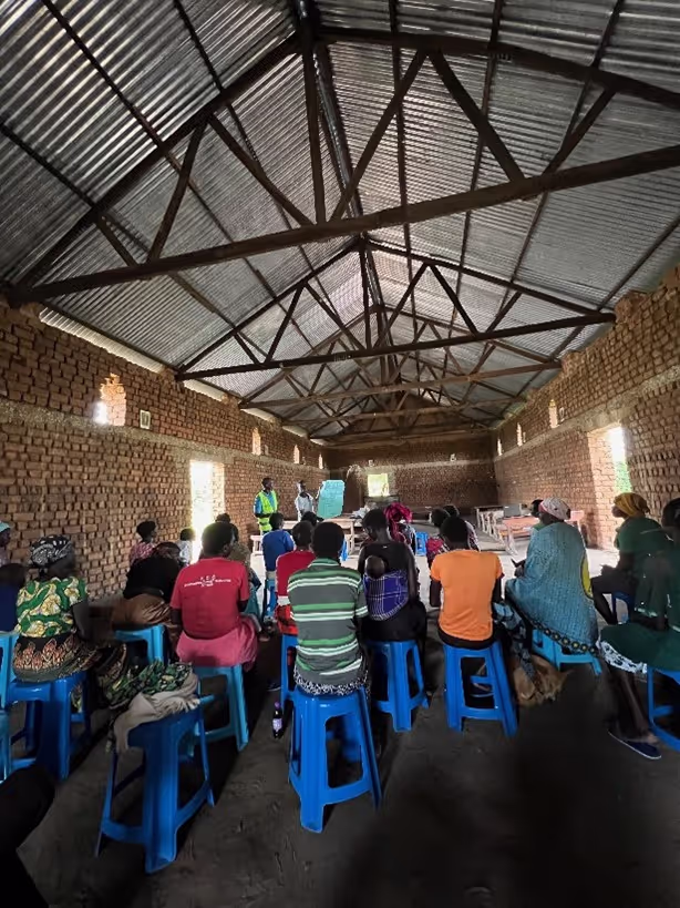 HRI: Facilitator and translator working together to go through an exercise with their grou