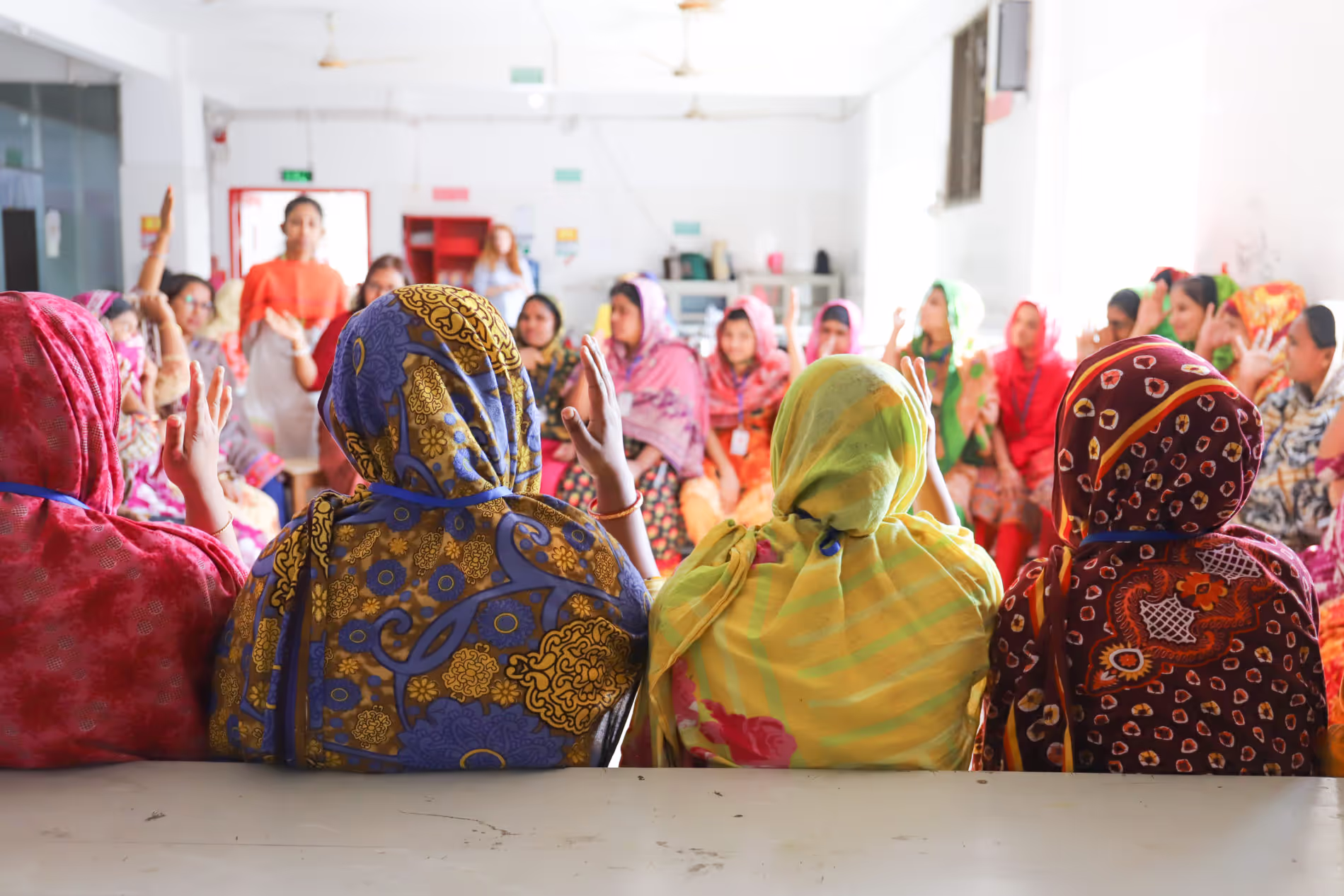 Garment workers participating in a educational session with Change Associates. Photo credit: Reemi