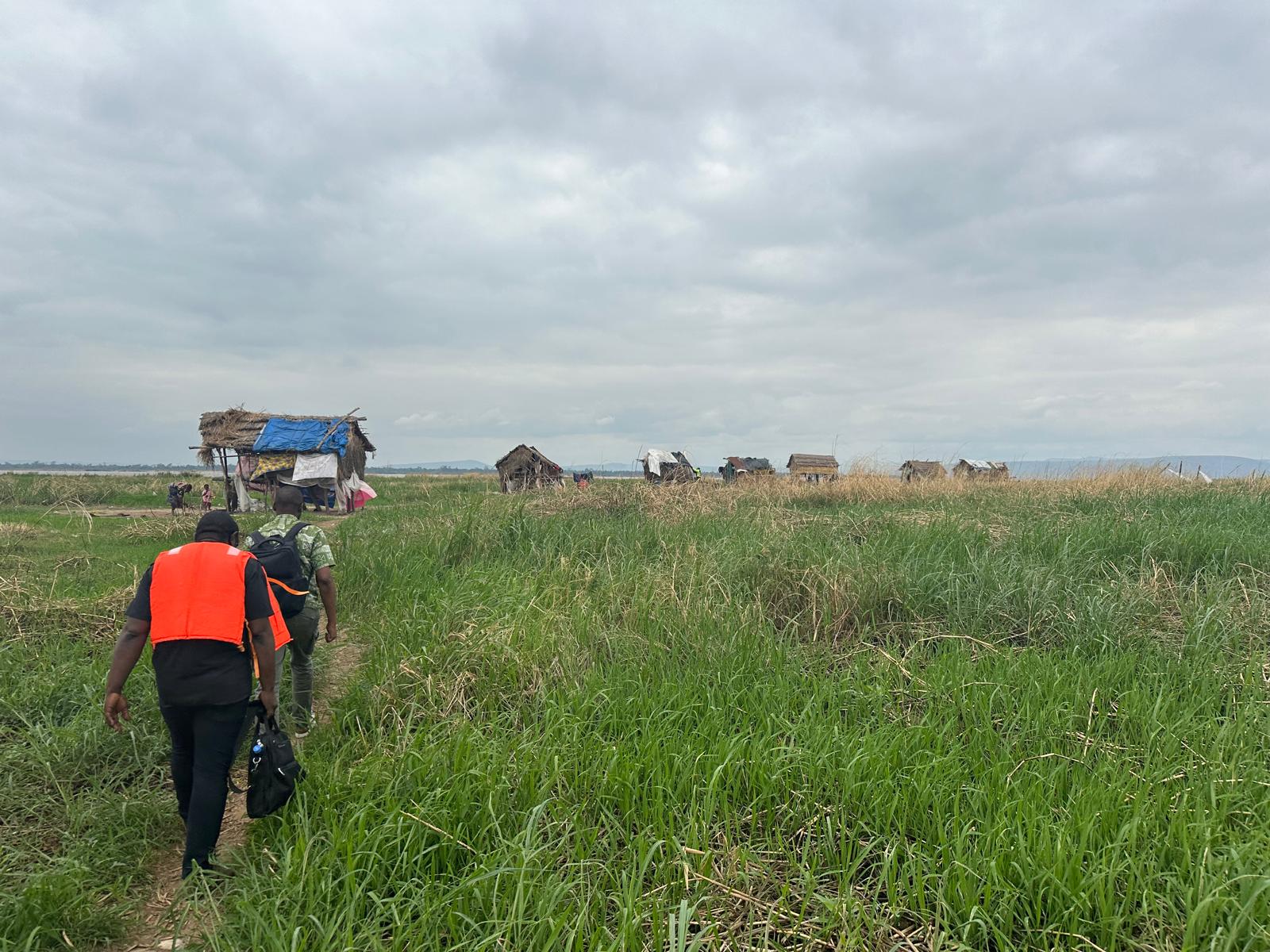 Team members Prof Dalau Nkamba and Dr. Georges Mutenge in Maluku Region, Kinshasa Province en route to administer a vaccination coverage survey among hard-to-reach communities, November 2024. Photo: Sydney Merritt.