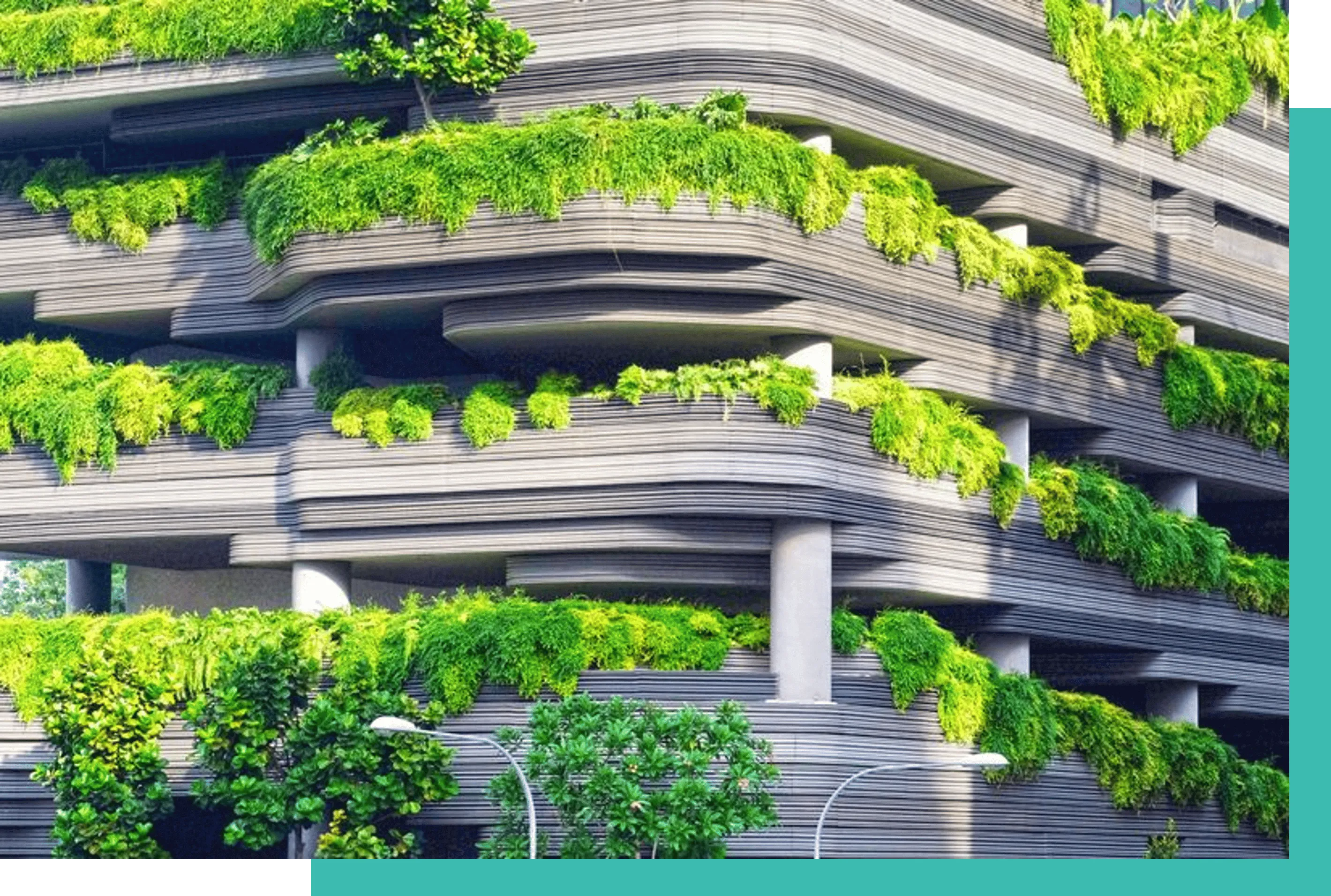 Modern multi-story building with curved horizontal lines and green plants cascading from terraces.