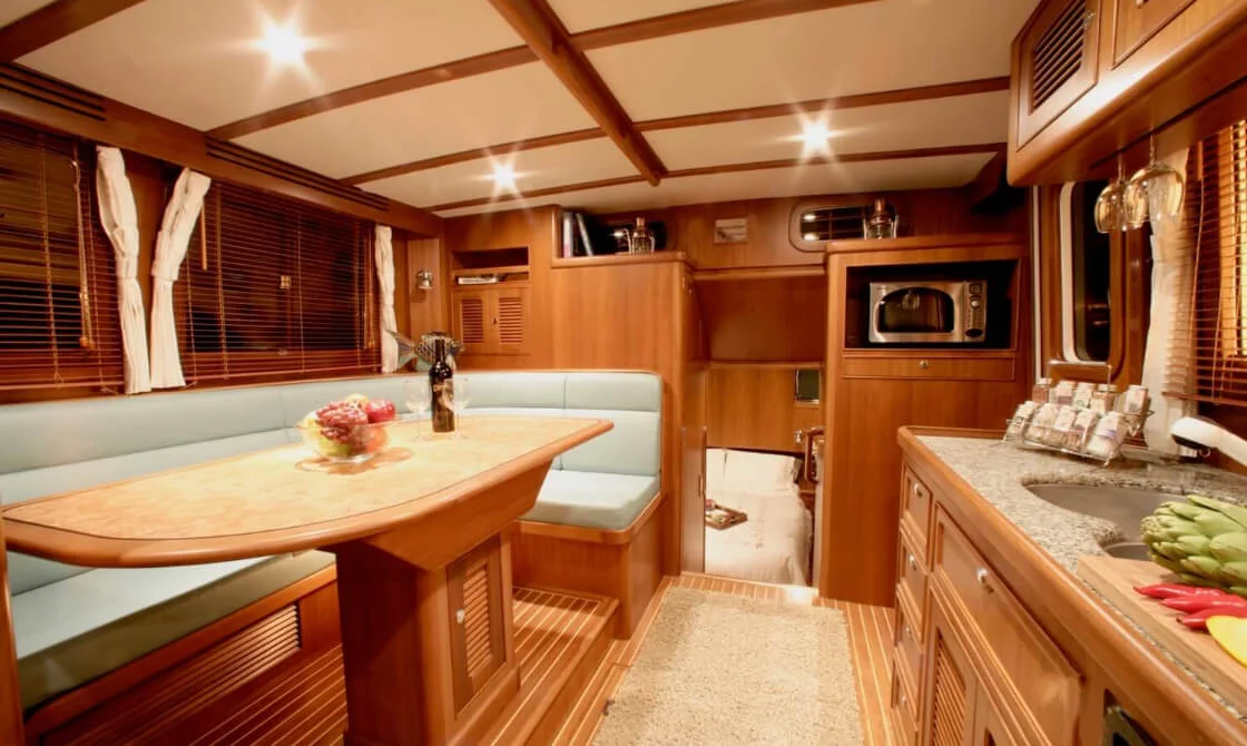42 archer cozy boat wooden interior dining kitchenette area