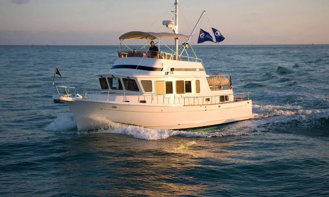 42 archer white yacht sailing on calm ocean under clear sky