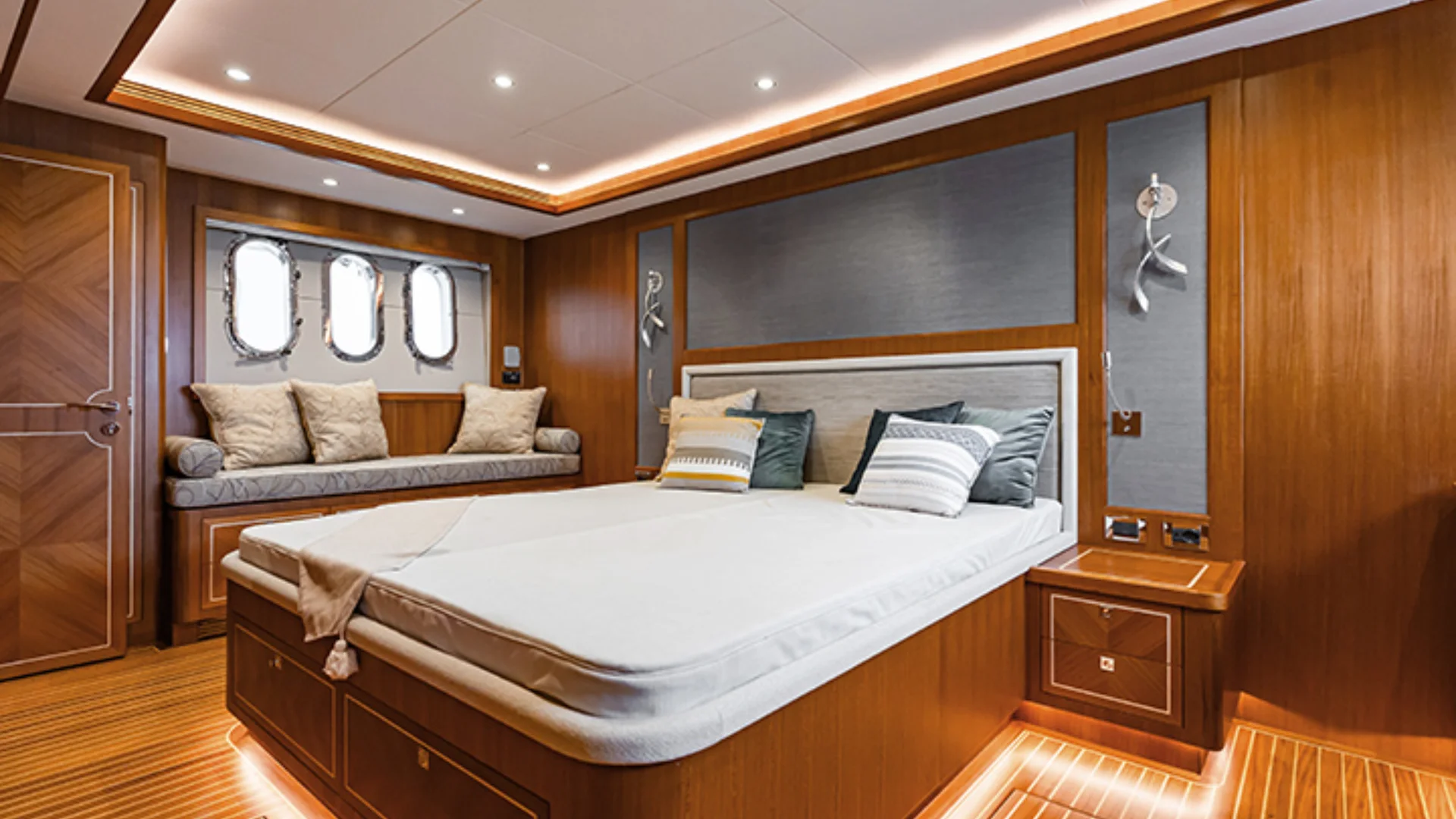 luxurious wooden cabin bedroom with bed and seating