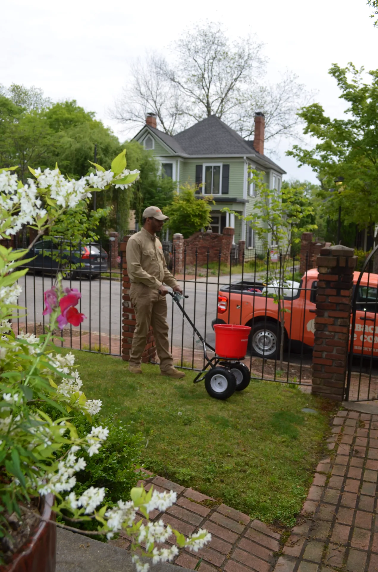 Technician spraying in a backyard