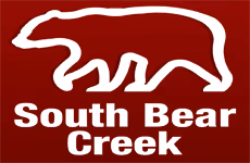 White bear silhouette logo with South Bear Creek text in red background