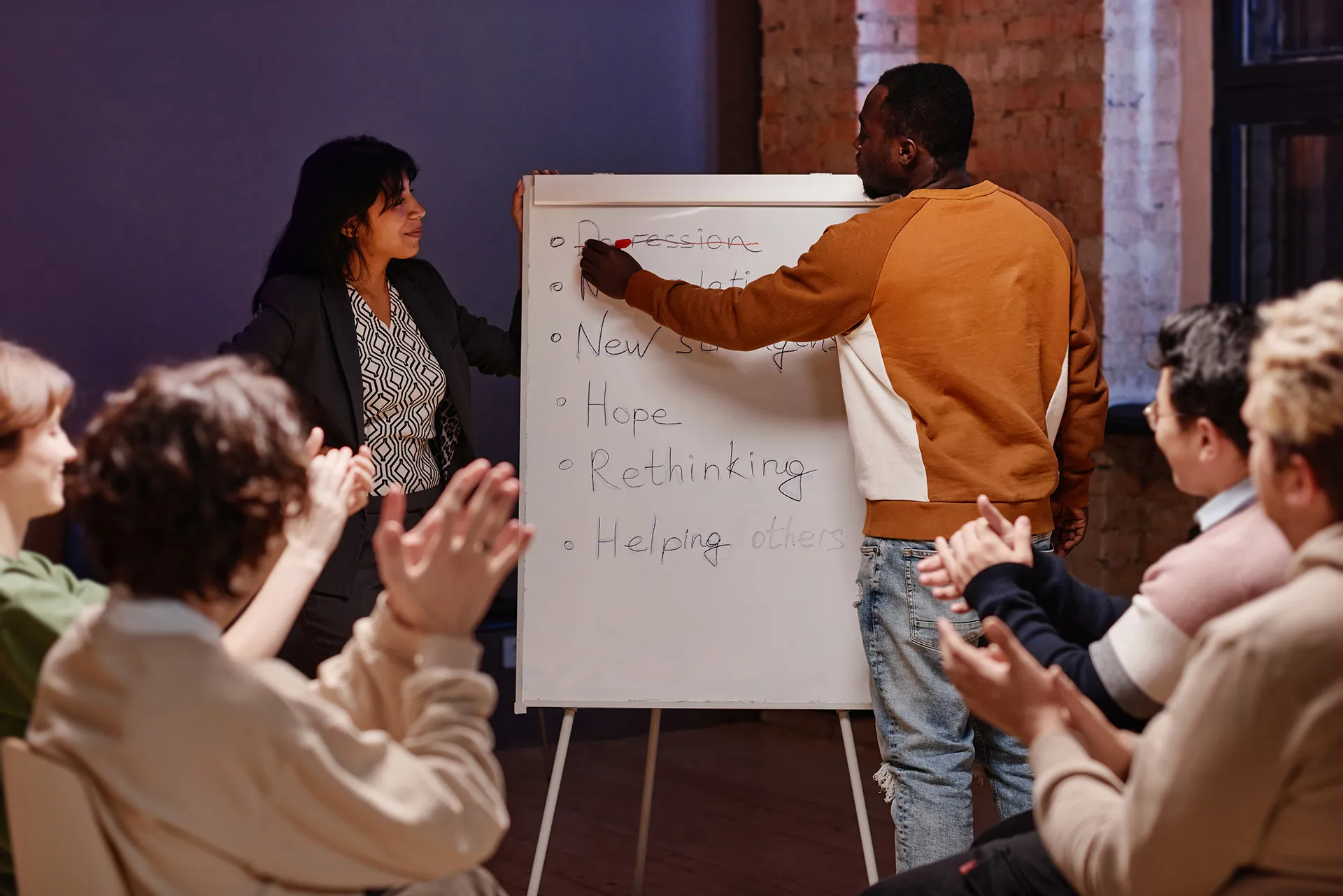 Team brainstorming session with whiteboard listing hope and rethinking concepts