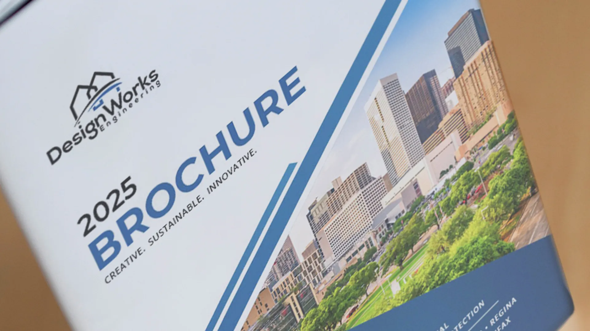 2025 Brochure cover with urban landscape and green spaces