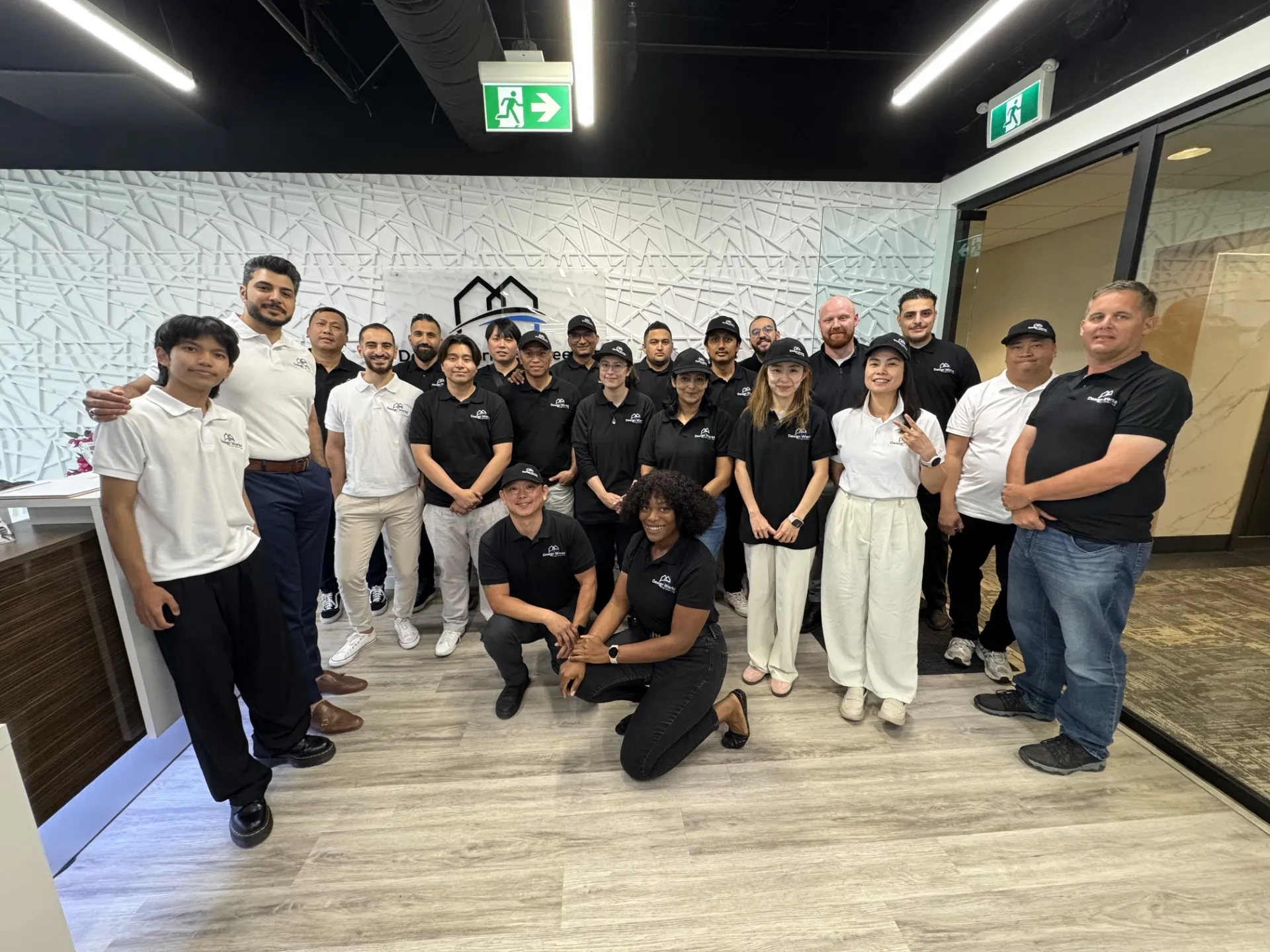 Design and Engineering team works together in modern office space for group photo