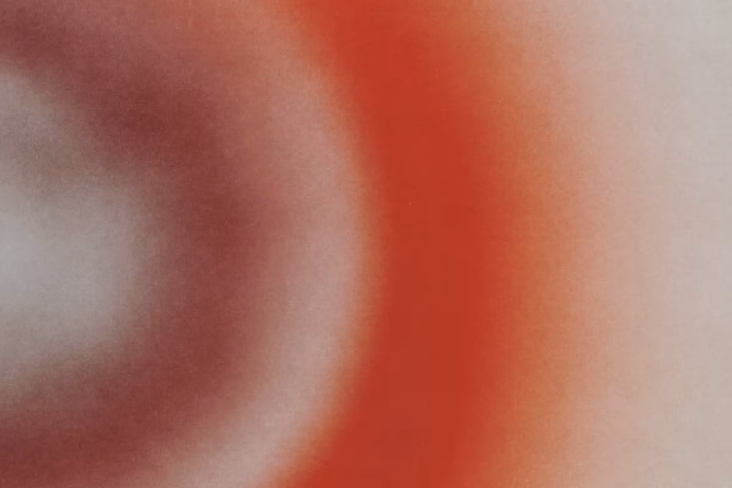 a close-up photo of red and white microbes in the vaginal microbiome some of which can influence your likelihood of viral STIs