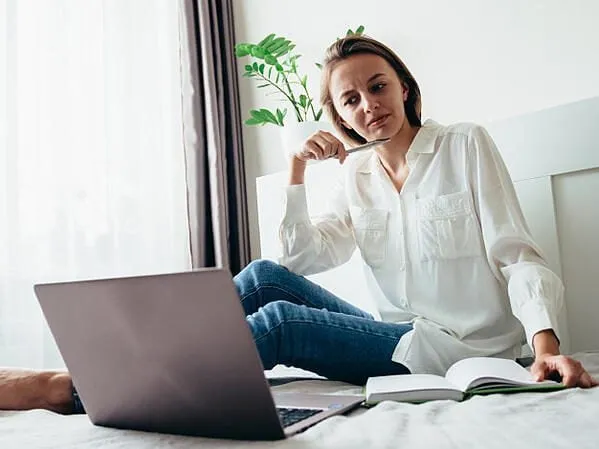 Recruiter looking at laptop.