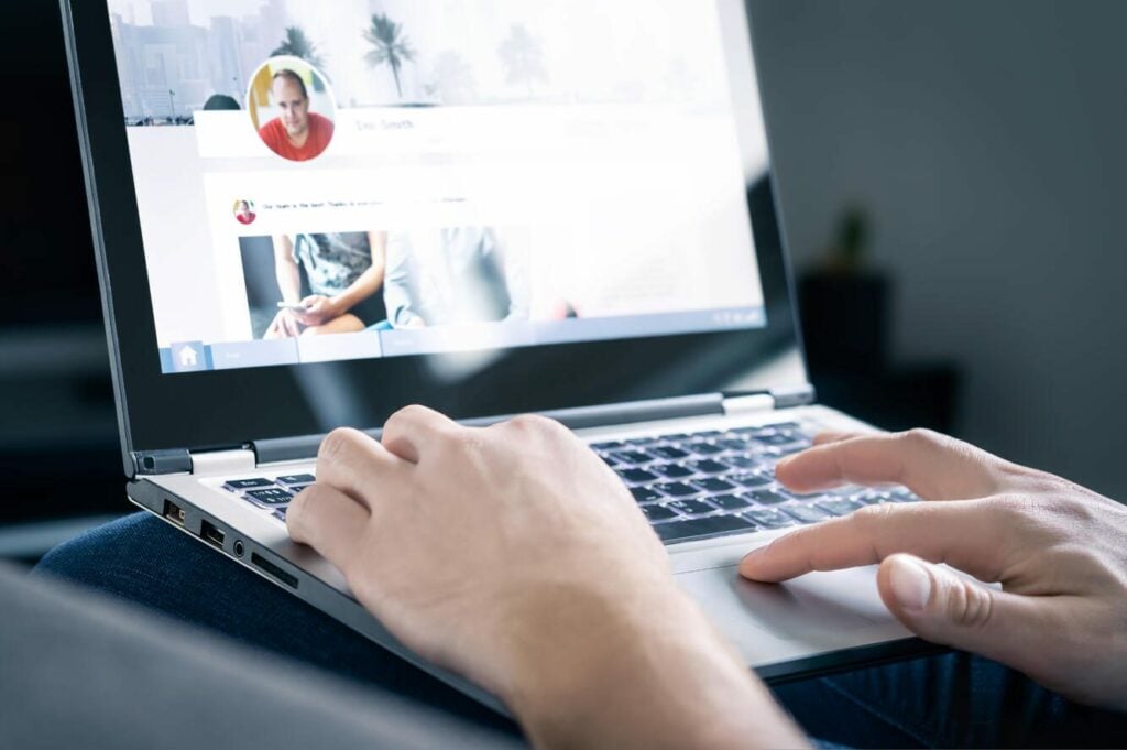 Person on laptop browsing the Internet.