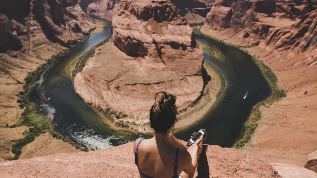 there is a woman taking a picture at the top