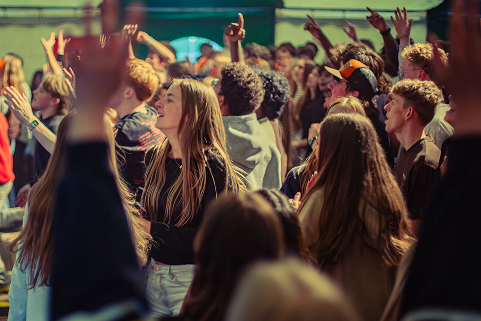 Youth with hands up