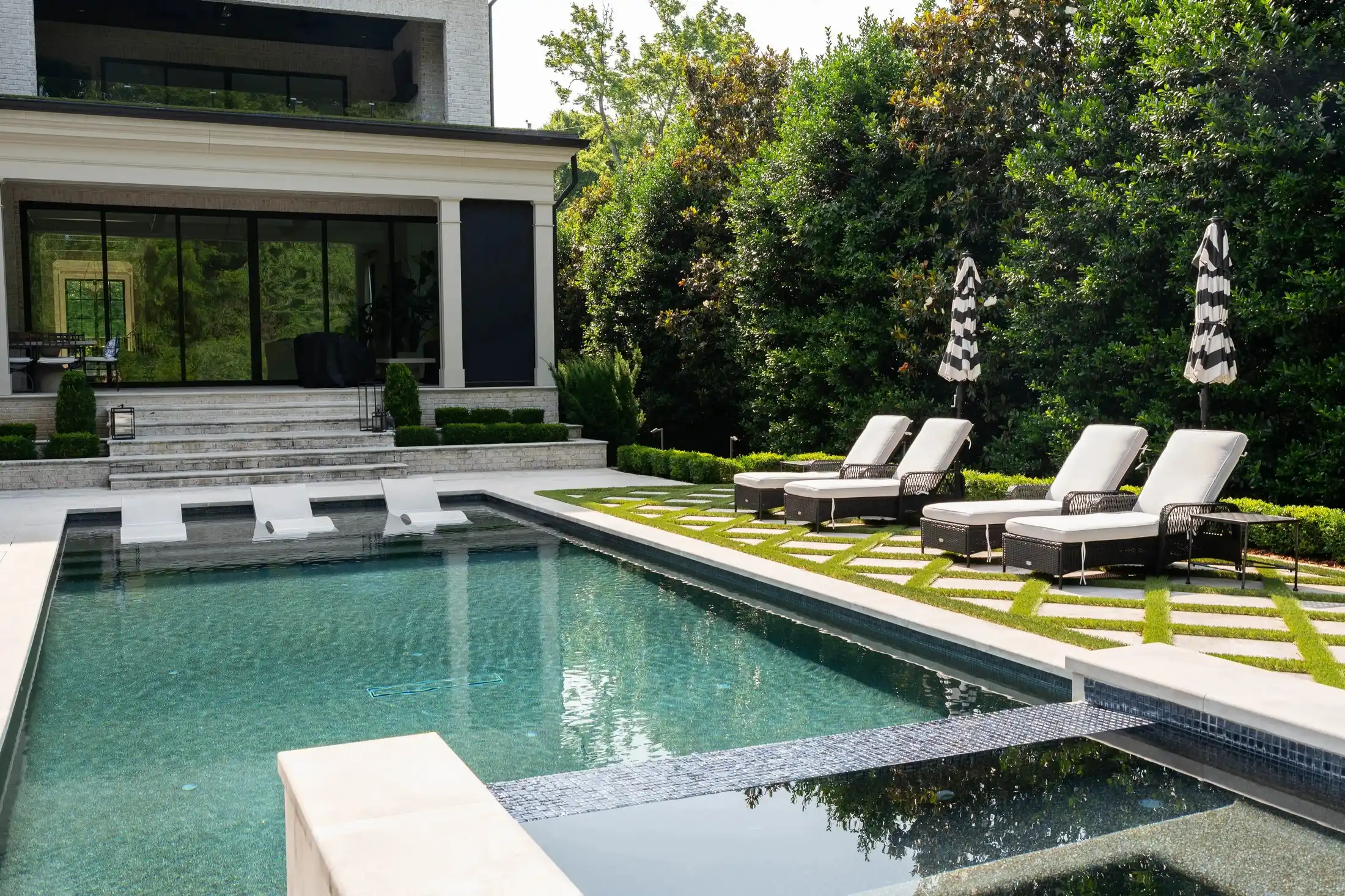 Modern luxury home with swimming pool and professionally maintained landscaping by Veragreen