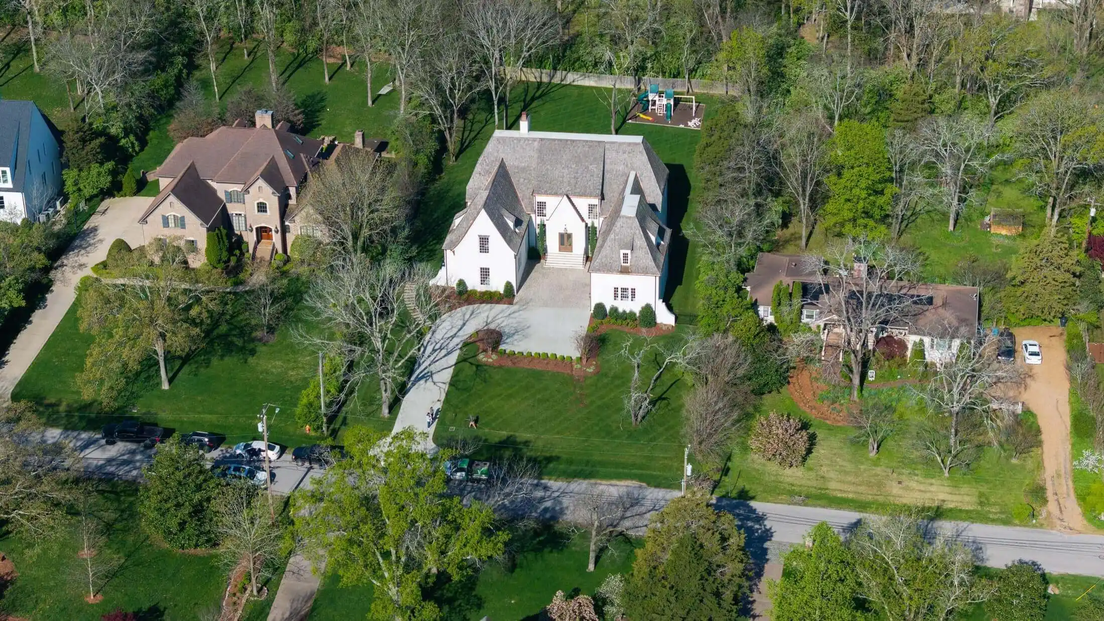 Aerial view of residential properties with professionally maintained lawns and landscaping by Veragreen