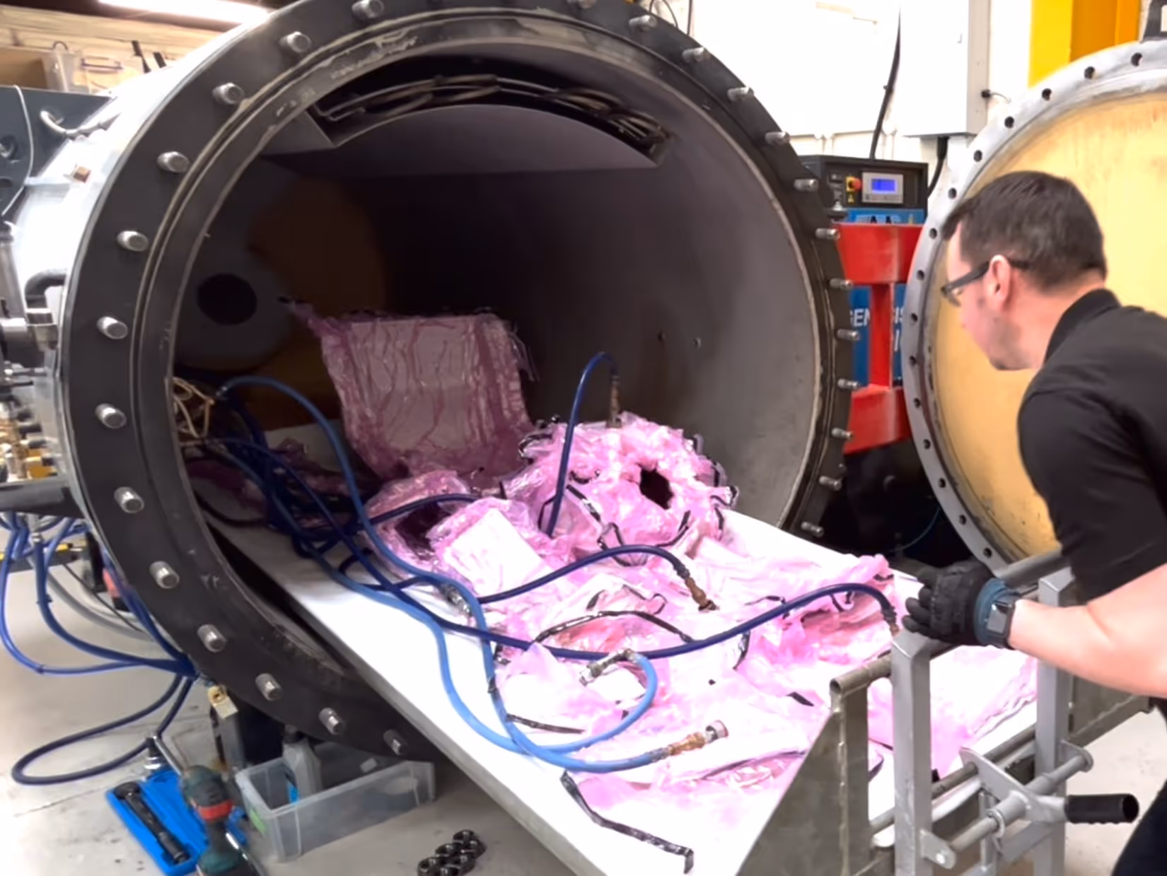 Vacuum bagged carbon fibre parts loaded into the autoclave at the Dissident workshop