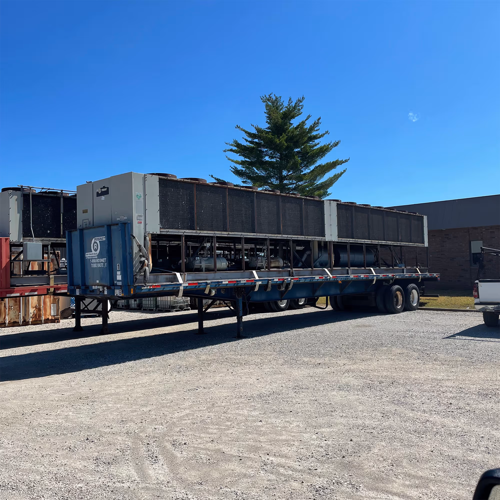 A flat bead trailer with HVAC components for a Freitag job.