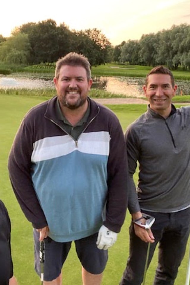 Mark and Tsen on a golf course