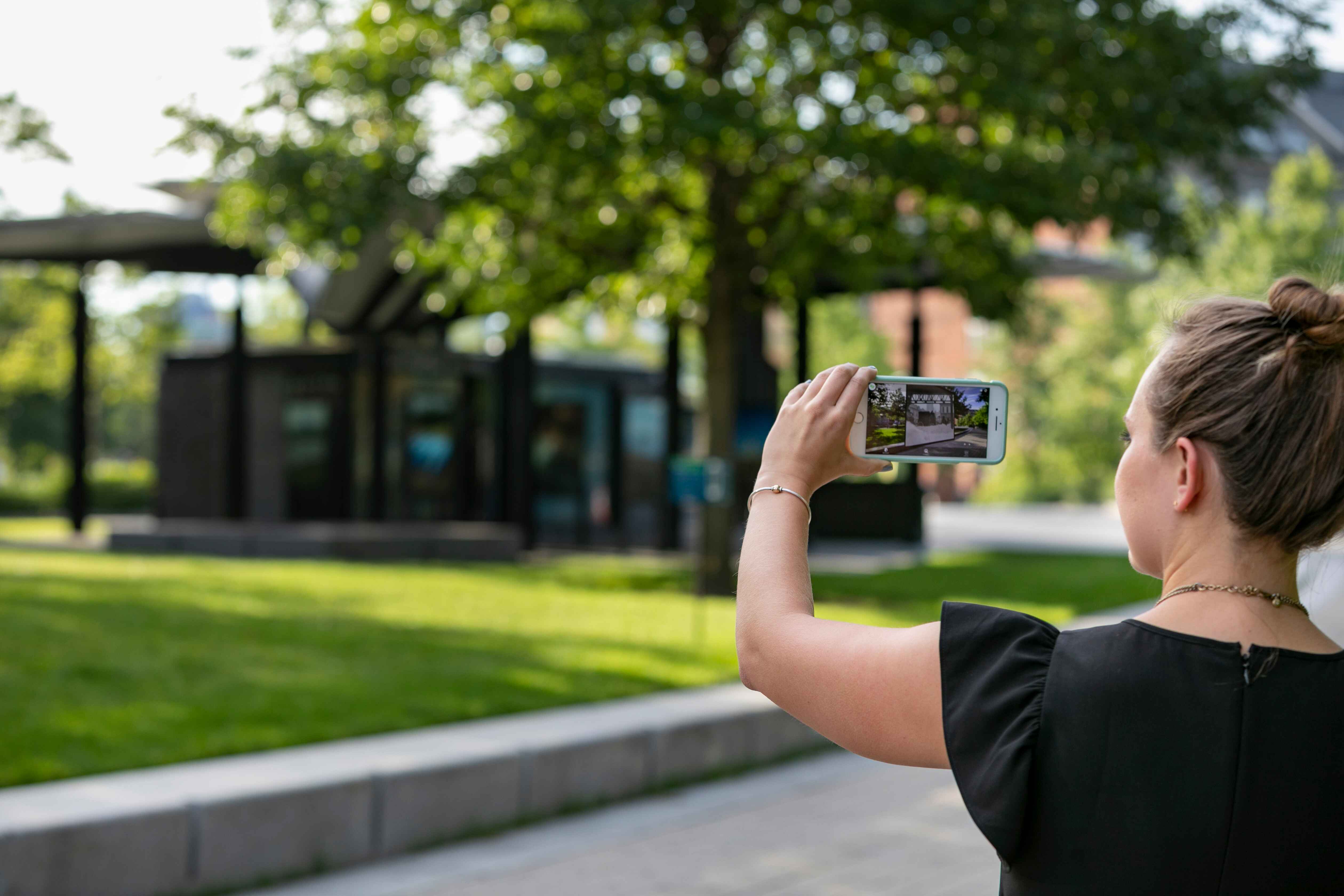 Person using hoverlay to experience Boston Greenway AR augmented