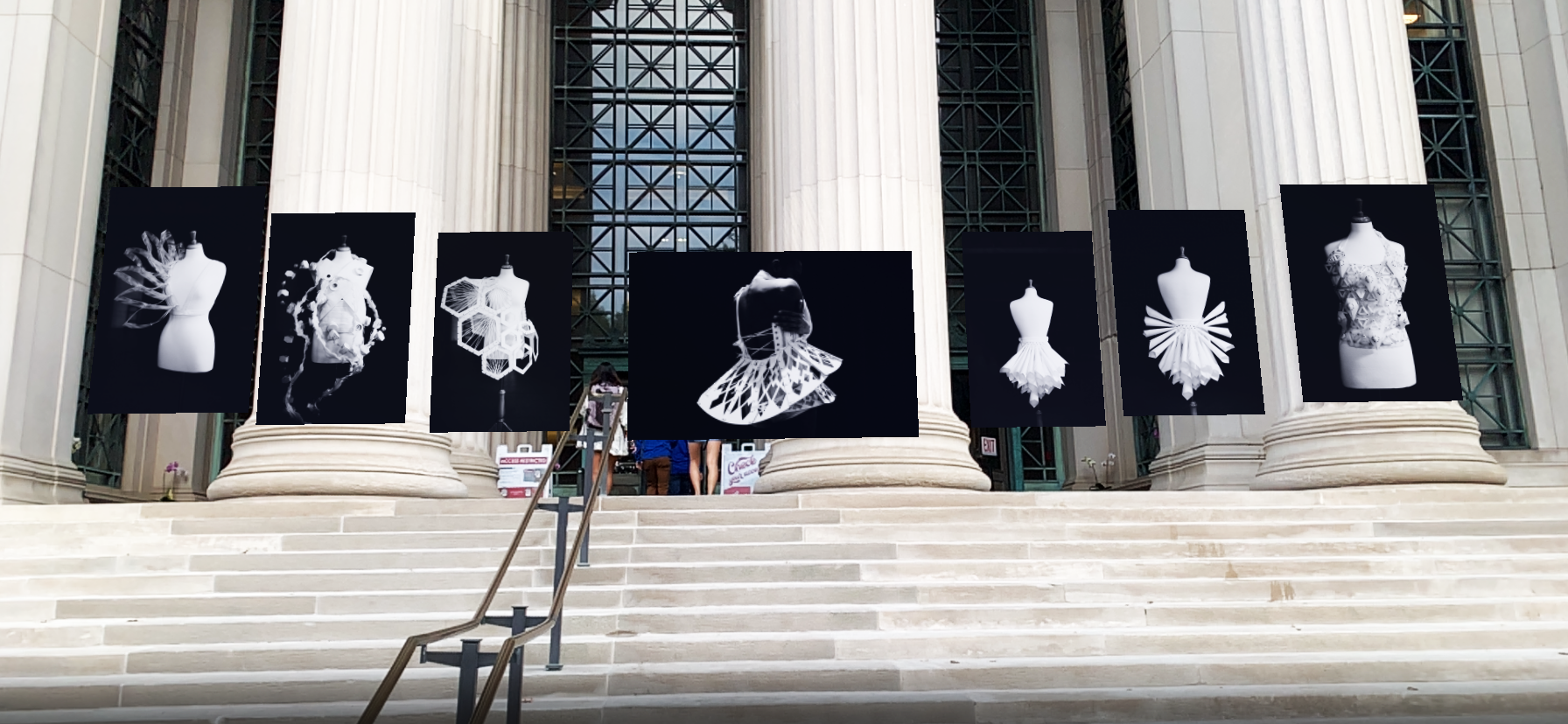 Art exhibition display outside a building with large stone columns, featuring seven augmented reality framed photos of avant-garde white geometric and abstract dress designs on mannequins, arranged above stone steps.