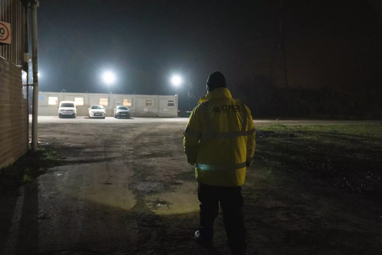 a CR2 security guard patrolling a client's property as part of their key holding service. 