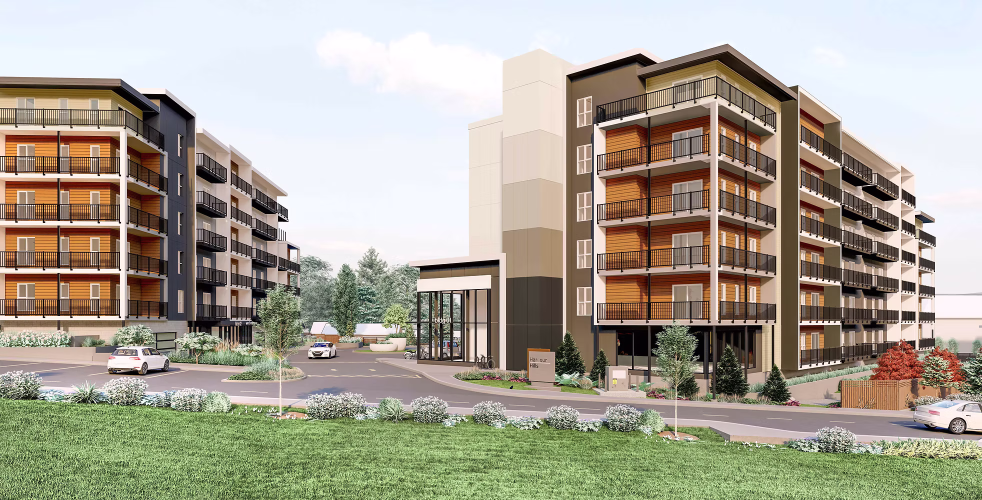 Modern apartment complex with multi-story buildings and landscaped entrance