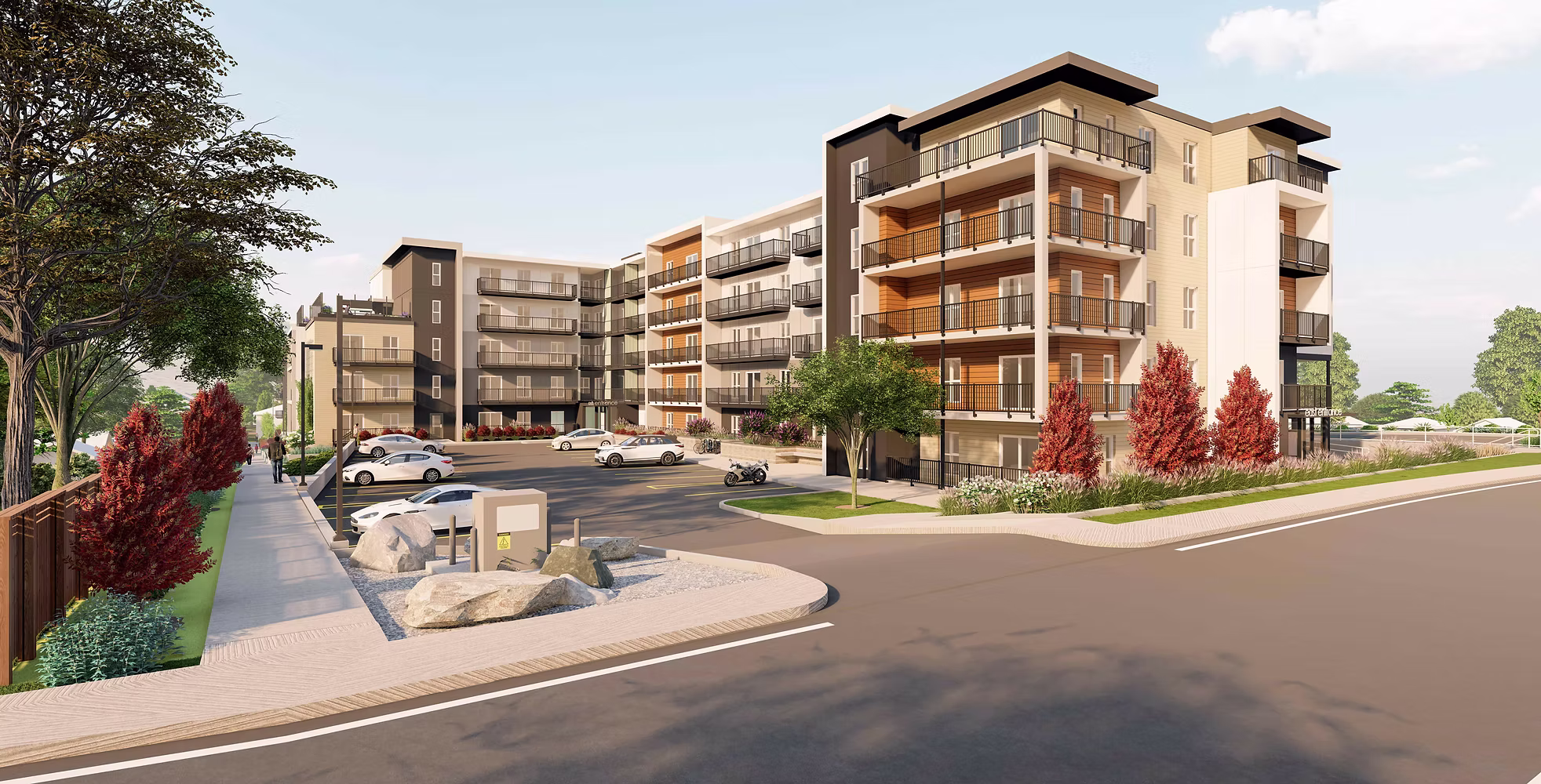 Modern multi-story apartment complex with parking and landscaped surroundings