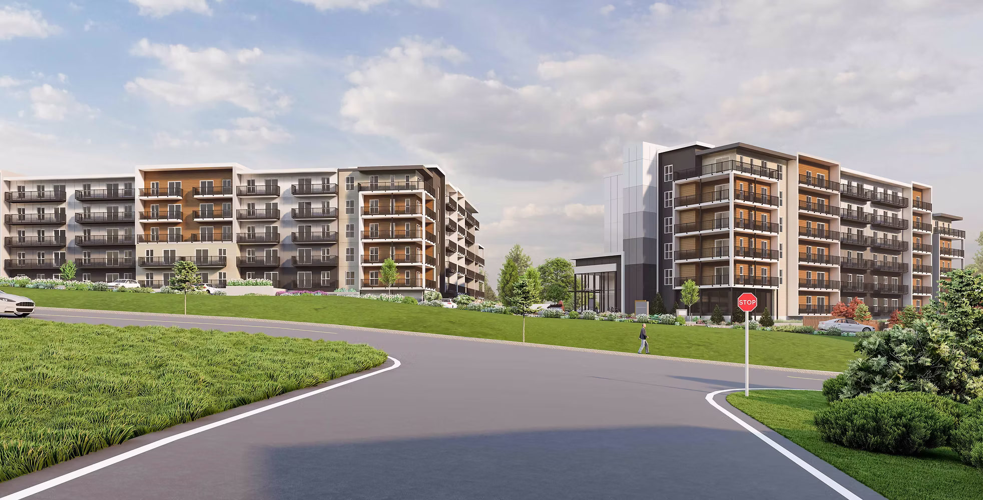 Modern apartment complex with multiple buildings and landscaped green area