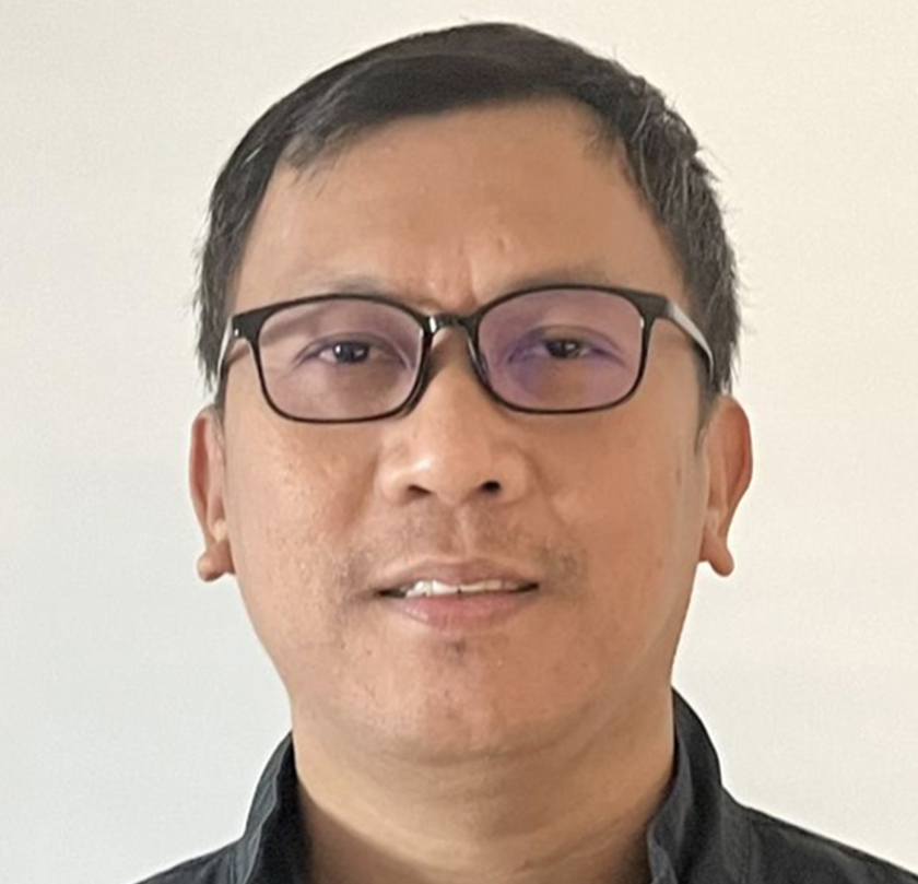 Professional portrait of man with glasses; design, works, engineering expert.