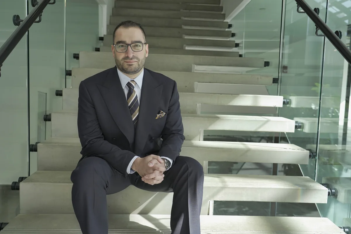 Professional engineer in modern stairwell, Design Works Engineering expertise showcased