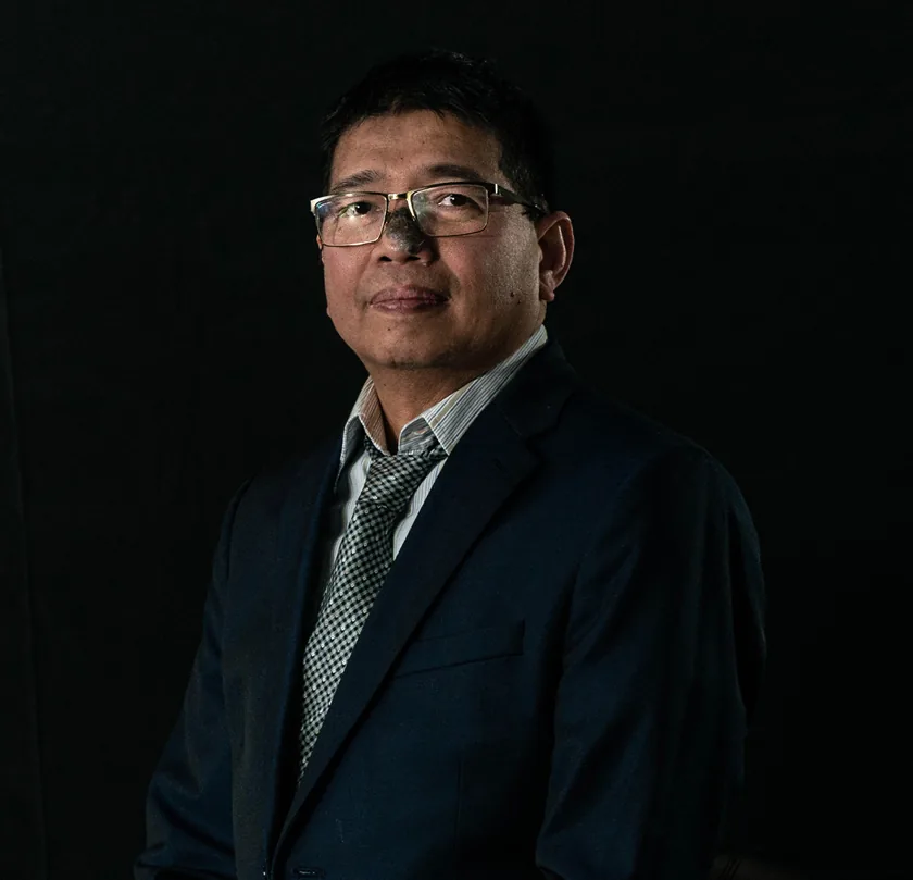 Professional portrait of male engineer in Design and Engineering Works business attire